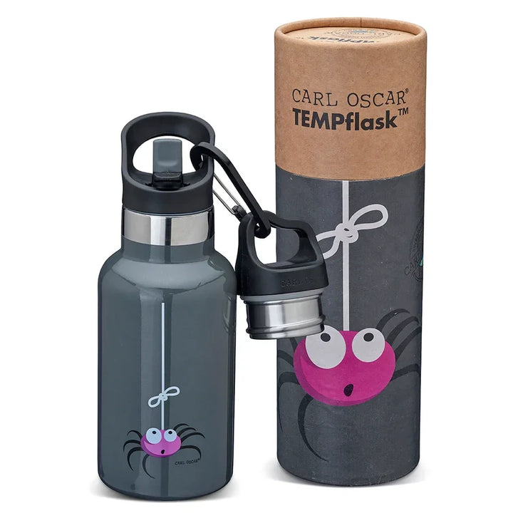 Graue Wasserflasche mit verspieltem rosa Spinnendesign, begleitet von einer passenden runden Pappschachtel.